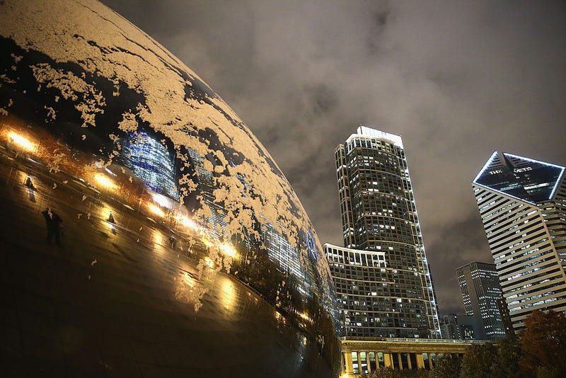 Snow collects on Anish Kapoor's Cloud Gate (also known as The Bean) in Milennium Park on November 11, 2013 in Chicago, Illinois. The snowfall was the first of the season for the city. (Photo by Scott Olson/Getty Images)