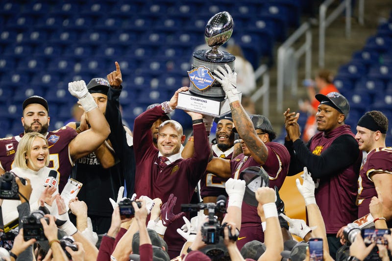 Head coach P.J. Fleck of the Minnesota Golden Gophers holds up the trophy after the Golden Gophers defeated the Bowling Green Falcons, 30-24, in the Quick Lane Bowl at Ford Field on December 26, 2023 in Detroit, Michigan.