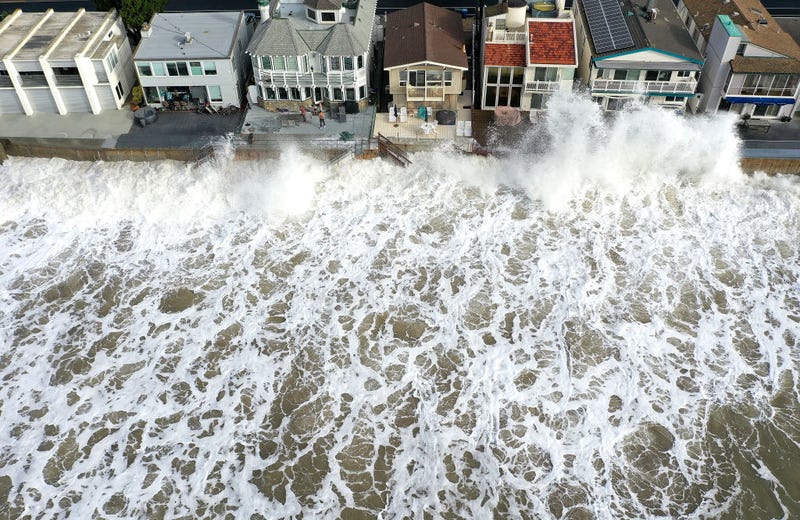An aerial view of Pacific Ocean waves crashing against a seawall protecting homes on December 30, 2023 near Ventura, California. Dangerous surf churned up by storms in the Pacific is impacting much of California’s coastline with coastal flooding possible in some low-lying areas. A 2023 study from UC San Diego Scripps Institution of Oceanography showed that California’s winter waves have increased in size since 1970 as climate change has warmed the planet. (Photo by Mario Tama/Getty Images)