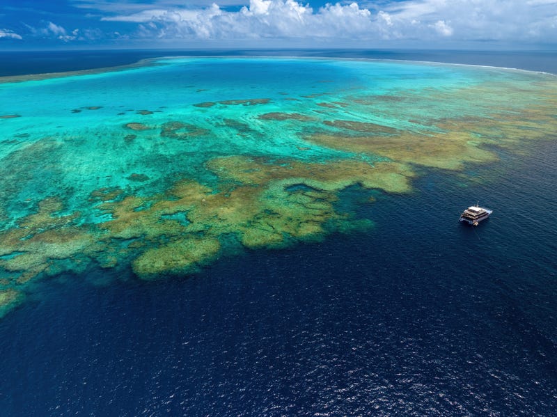 Aerial photograph of a boat at the Bougainville Reef in Coral Sea