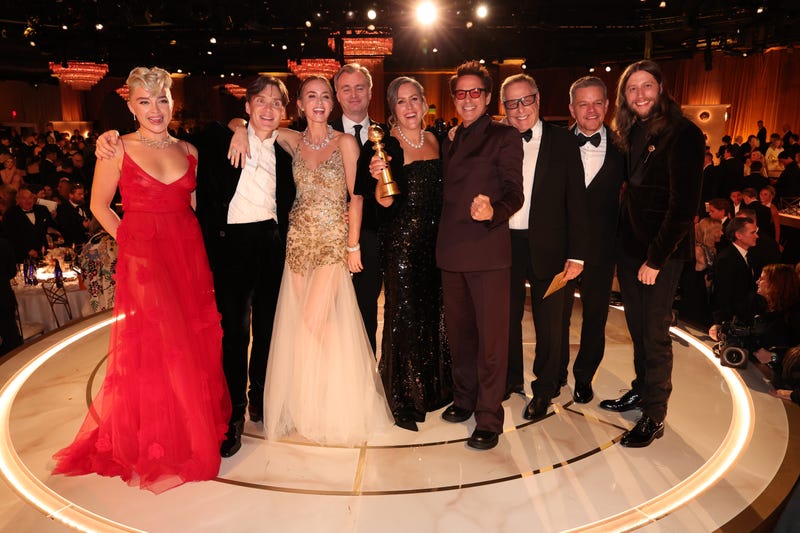Florence Pugh, Cillian Murphy, Emily Blunt, Christopher Nolan, Emma Thomas, Robert Downey Jr., Charles Roven, Matt Damon and Ludwig Göransson accept award