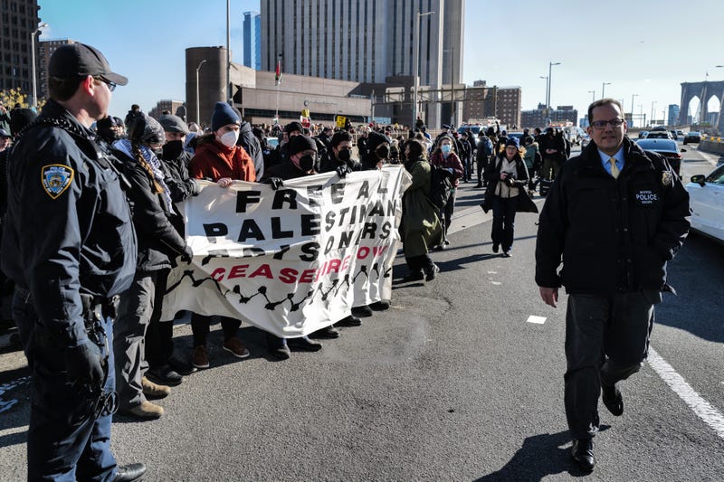 NYPD officers arrest pro-Palestinian protesters as they gathered and blocked the Manhattan entrance of the Brooklyn Bridge