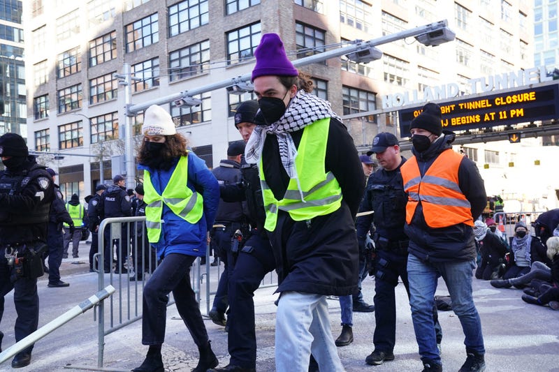 Protesters are arrested for blocking traffic at the entrance to the Holland Tunnel