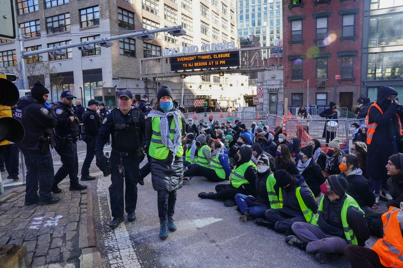 Protesters are arrested for blocking traffic at the entrance to the Holland Tunnel