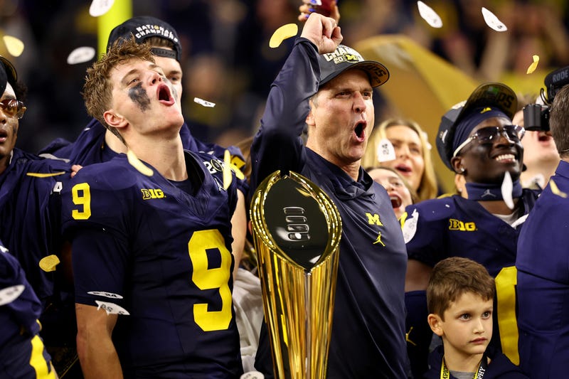 J.J. McCarthy #9 and Head Coach Jim Harbaugh of the Michigan Wolverines