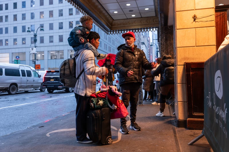 Migrants and their families check into a processing center at the Roosevelt Hotel in Midtown Manhattan last year