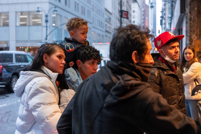 Migrants and their families check into a processing center at the Roosevelt Hotel in Midtown Manhattan as thousands of migrants continue to arrive into the city weekly on Jan. 9, 2024