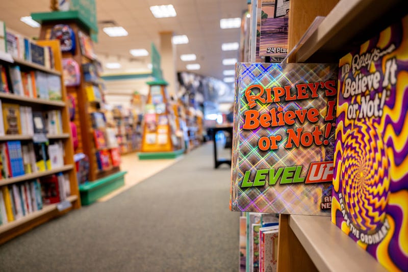 In a photo illustration, a 'Ripley's Believe It or Not!' book is pulled out on a shelf at a Barnes & Noble store on January 11, 2024 in Austin, Texas. The book is among several being banned in a Florida school district. The Escambia county, Florida school district is facing a federal lawsuit after removing copies of dictionaries, encyclopedias and various other books containing "sexual conduct." The school district decision comes after officials ruled in accordance with a law signed by Florida Gov. Ron DeSantis, which restricts access to information containing sexual conduct in the Florida educational system. (Photo by Brandon Bell/Getty Images)