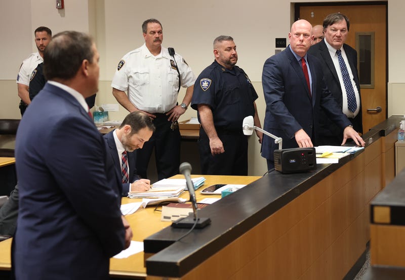 Alleged Gilgo serial killer Rex Heuermann (R) appears before Judge Timothy P. Mazzei with his attorney Michael Brown (2nd R) at Suffolk County Court on January 16, 2024 in Riverhead