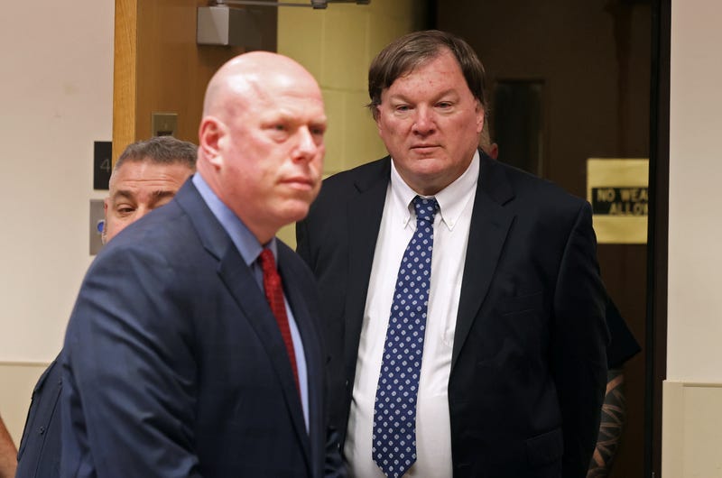 Alleged Gilgo Beach serial killer Rex Heuermann appears before Judge Timothy P. Mazzei with his attorney Michael Brown at Suffolk County Court on Jan. 16, 2024, in Riverhead