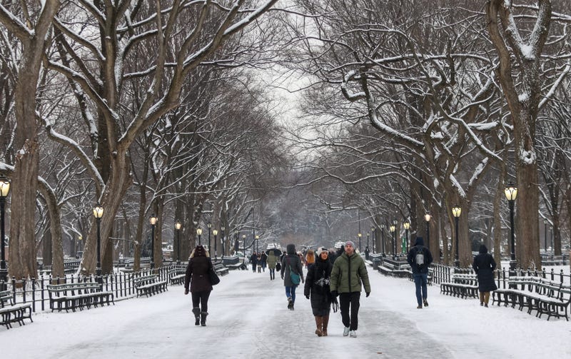 People walk through Central Park after a snowstorm on Jan. 16, 2024
