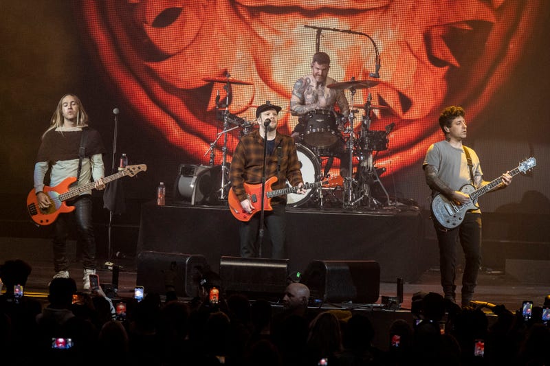 Pete Wentz, Patrick Stump, Andy Hurley and Joe Trohman perform