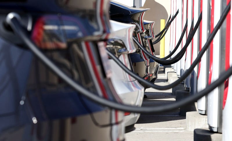 Tesla electric cars recharge at a Tesla Supercharger station on January 16, 2024 in Burbank, California.