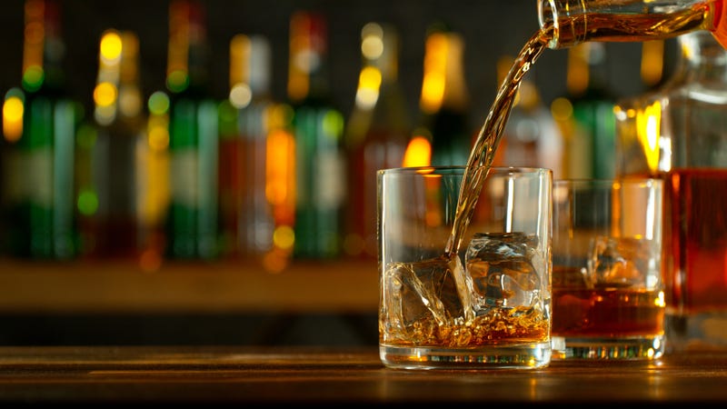 Liquor bottle pouring into glass