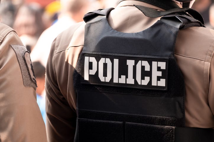 Police officer in a bullet proof vest. 