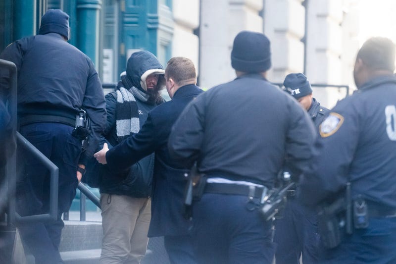 New York Police are seen detaining a suspected stalker outside Taylor Swift's apartment in Tribeca on January 20, 2024 in New York City.