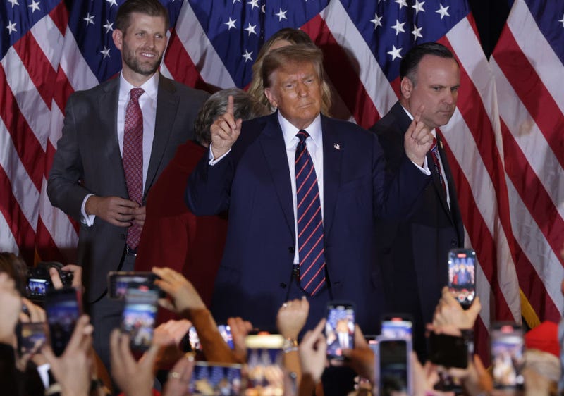 Republican presidential candidate and former U.S. President Donald Trump celebrates on stage during his primary night rally at the Sheraton on January 23, 2024 in Nashua, New Hampshire.