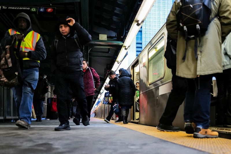 People are seen at a subway station in New York on January 29, 2024