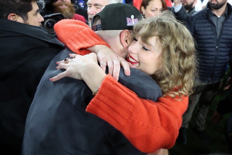 Travis Kelce #87 of the Kansas City Chiefs celebrates with Taylor Swift after a 17-10 victory against the Baltimore Ravens in the AFC Championship Game at M&T Bank Stadium on Jan. 28, 2024, in Baltimore, Maryland.