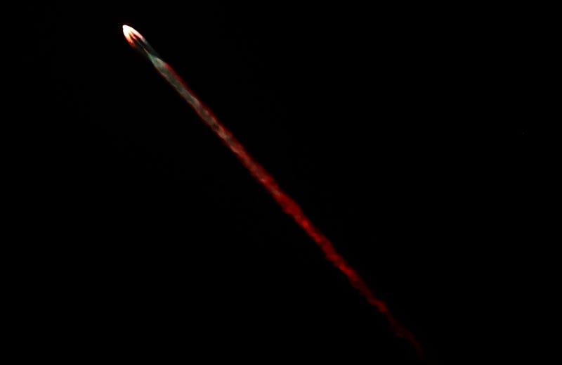 A SpaceX Falcon 9 rocket flies carrying a payload of 22 Starlink satellites into space after launching from Vandenberg Space Force Base on January 28, 2024 as seen from Los Angeles, California.