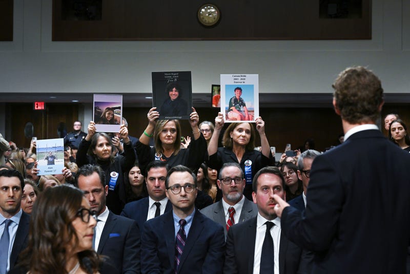 CEO of Meta, Mark Zuckerberg acknowledges family members as they hold up photos during a Senate Judiciary Committee hearing with representatives of social media companies at the Dirksen Senate Office Building on Wednesday January 31, 2024 in Washington, DC.