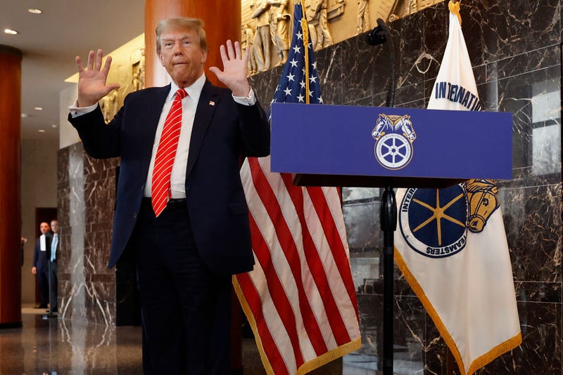 Republican presidential candidate and former U.S. President Donald Trump holds up his hands after being asked about them by reporters at the International Brotherhood of Teamsters headquarters on January 31, 2024 in Washington, DC. Trump met with leaders and members of the organized labor group while looking for union support after the United Auto Workers endorsed President Joe Biden's re-election campaign one week ago. 
