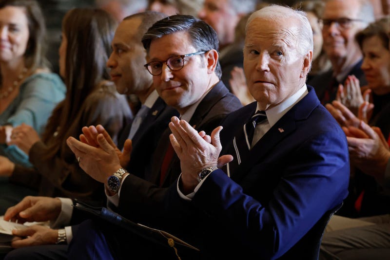 President Joe Biden (R) and Speaker of the House Mike Johnson (R-LA) applaud for Andrea Bocelli after he performed "Amazing Grace" during the annual National Prayer Breakfast in Statuary Hall in the U.S. Capitol on February 01, 2024 in Washington, DC. The gathering of elite political, social and business leaders has been attended by every president since Dwight D. Eisenhower. This is the first year the event is being hosted by the National Prayer Breakfast Foundation inside the Capitol after being controlled for decades by the Christian evangelical group the Fellowship Foundation. (Photo by Chip Somodevilla/Getty Images)