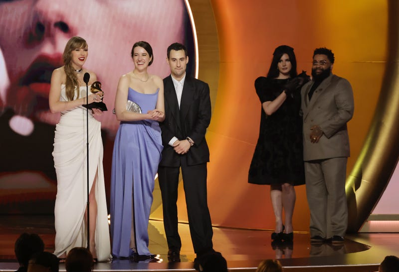 L-R) Taylor Swift accepts the Album Of The Year award for "Midnights" with Laura Sisk, Jack Antonoff and Lana Del Rey onstage during the 66th GRAMMY Awards at Crypto.com Arena on February 04, 2024 in Los Angeles, California. 