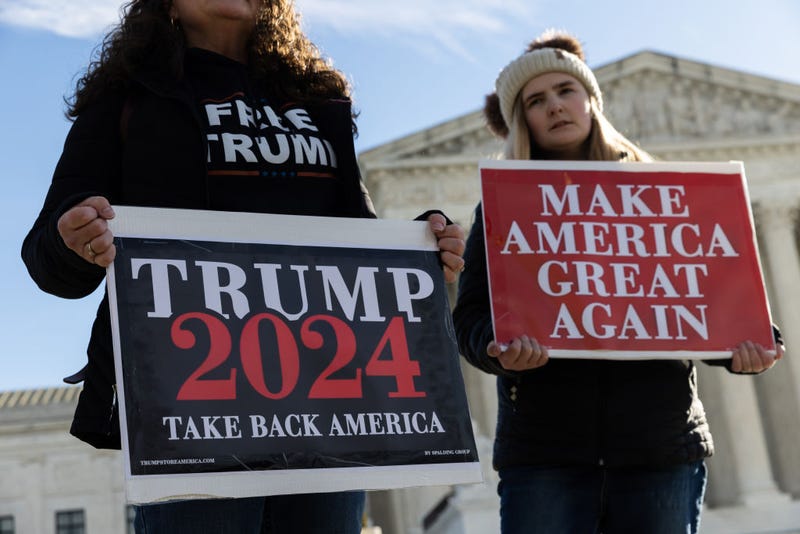 Protesters demonstrate outside of the U.S. Supreme Court on February 8, 2024 in Washington, DC. where justices are hearing oral arguments in a case on whether or not former President Trump can remain on the ballot in Colorado for the 2024 presidential election.