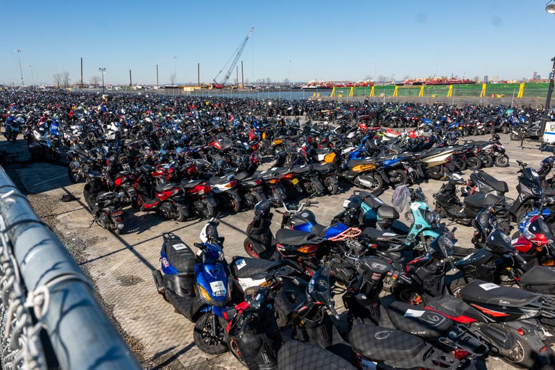 Scooters and motorcycles seized from the streets are stored at a tow yard in Brooklyn on February 5, 2024