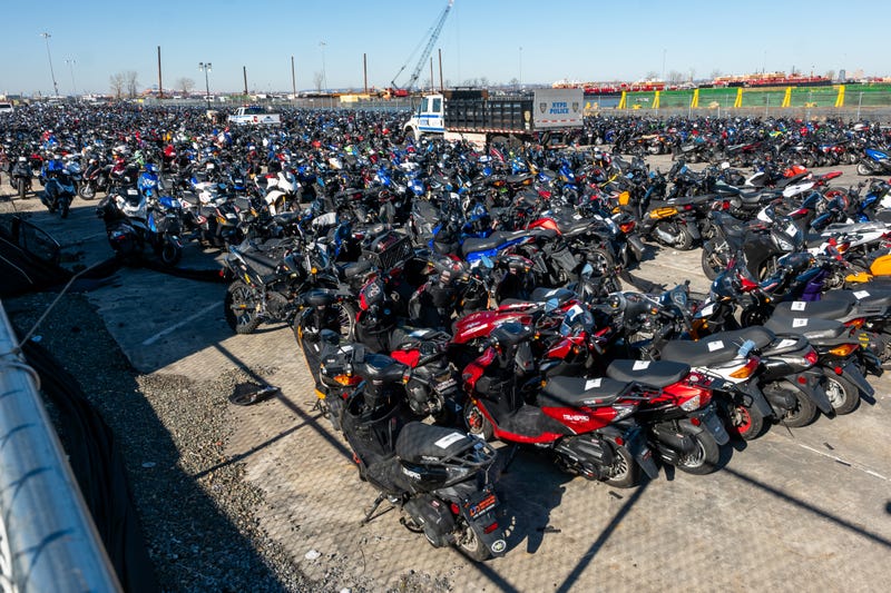 Scooters and motorcycles seized from the streets are stored at a tow yard in Brooklyn on February 5, 2024. The NYPD has said many are involved in crimes