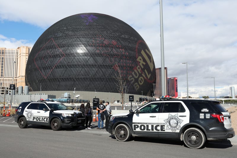 Individuals are seen in handcuffs near the Sphere after law enforcement responded to reports that pro-life activist Maison DesChamps (not pictured) had climbed to the top of the structure on February 07, 2024 in Las Vegas, Nevada.