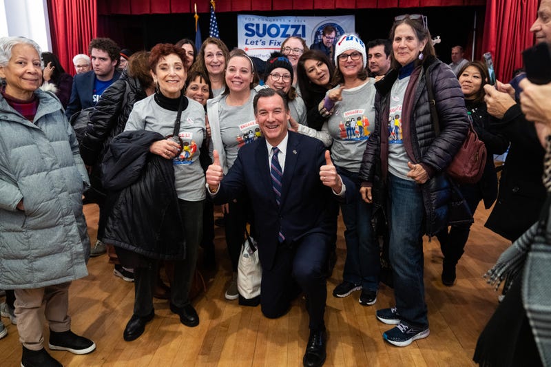 Former Rep. Tom Suozzi, Democratic candidate for New York's 3rd Congressional District, takes a picture with supporters during a campaign rally at the Polish National Home in Glen Cove, N.Y., on Sunday, February 4, 2024
