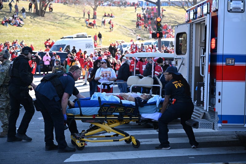 An injured person is loaded on an ambulance near the Kansas City Chiefs' Super Bowl LVIII victory parade on February 14, 2024, in Kansas City, Missouri.