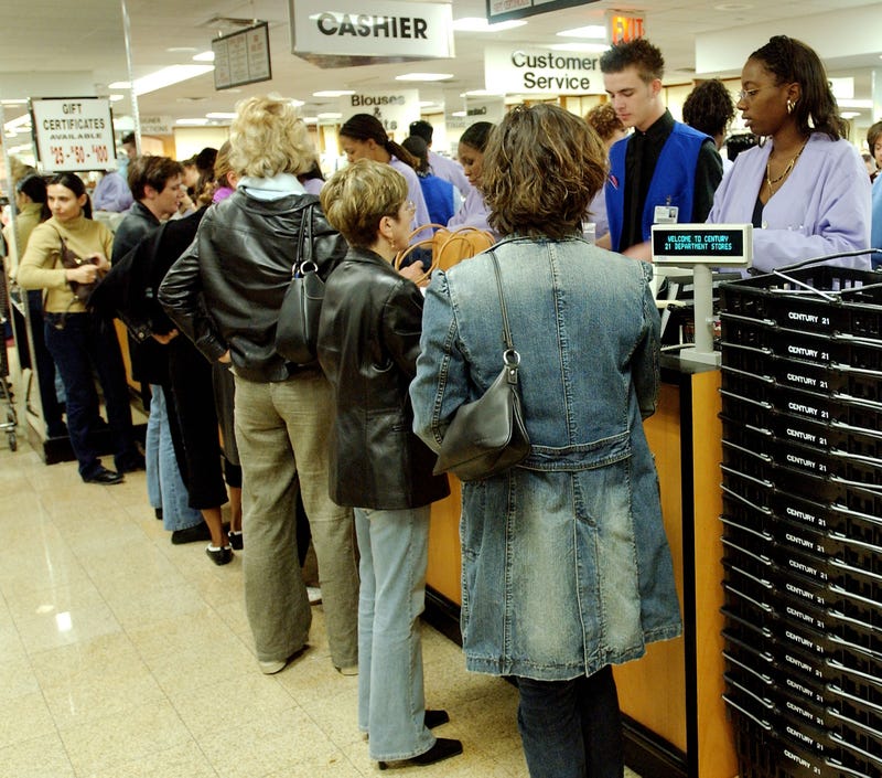 Shoppers wait in line at a Century 21 store in New York City.