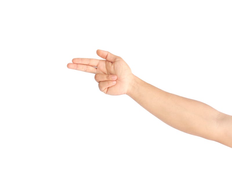 Male hand making a gesture like holding a gun