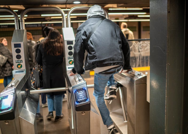 A man jumps a turnstile in the subway earlier this year