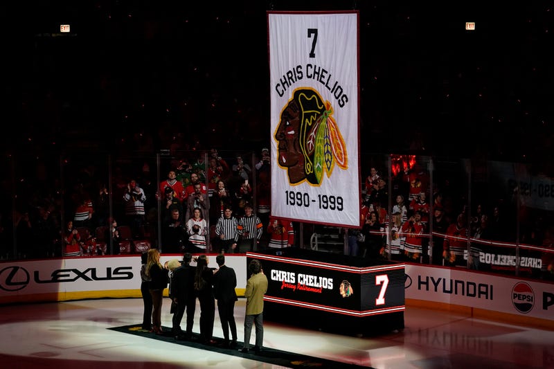 Chris Chelios and his family watch as his number is lifted to the rafters.
