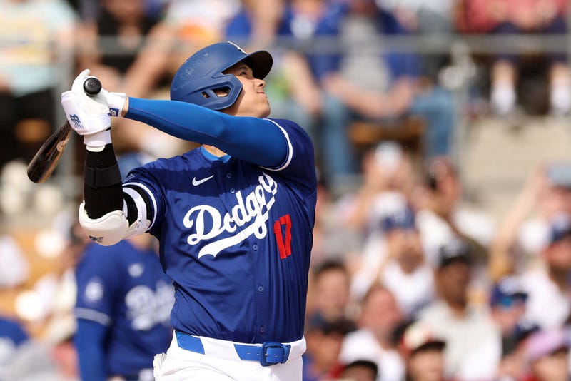 Shohei Ohtani #17 of the Los Angeles Dodgers hits a two-run home run in the fifth inning inning during a game against the Chicago White Sox at Camelback Ranch on February 27, 2024 in Glendale, Arizona.