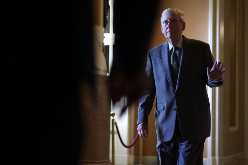 U.S. Senate Minority Leader Sen. Mitch McConnell (R-KY) waves to a person passing by as he walks in a hallway at the U.S. Capitol on February 29, 2024 in Washington, DC. The Senate continues to work on a interim spending bill to fund the government. (Photo by Alex Wong/Getty Images)