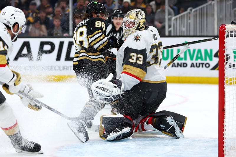 David Pastrnak #88 of the Boston Bruins collides with Adin Hill #33 of the Vegas Golden Knightsduring the first period at TD Garden on February 29, 2024 in Boston, Massachusetts.