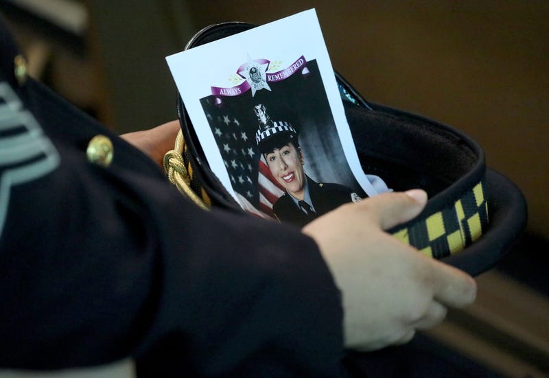 A Chicago police officer with the image of fellow Officer Ella French in his hat at the funeral service for French on Aug. 19, 2021, at St. Rita of Cascia Shrine Chapel in Chicago.