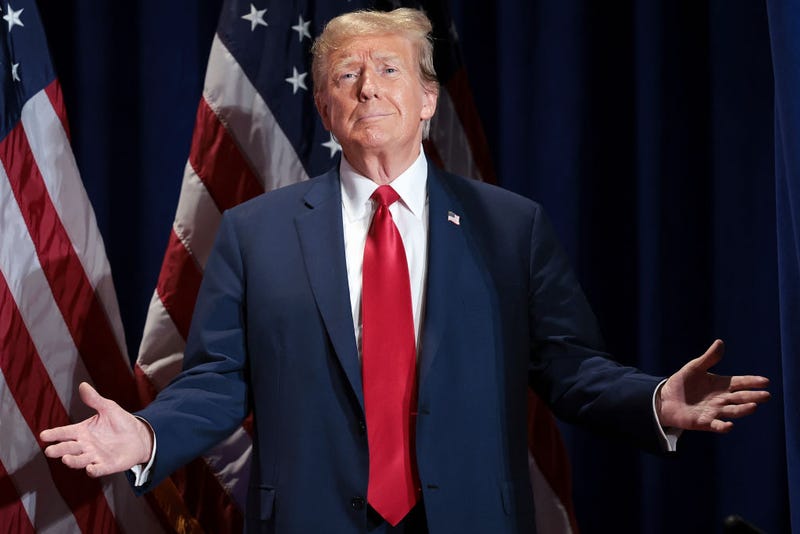 Republican presidential candidate and former President Donald Trump reacts to supporters as he arrives on stage during a Get Out the Vote Rally March 2, 2024 in Richmond, Virginia. Sixteen states, including Virginia, will vote during Super Tuesday on March 5. 