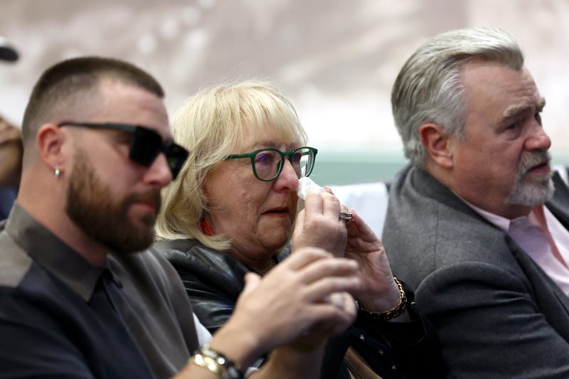 From left: Jason Kelce's brother, Travis; his mother, Donna; and his father, Ed, react during the announcement of his retirement at NovaCare Complex on March 4, 2024.