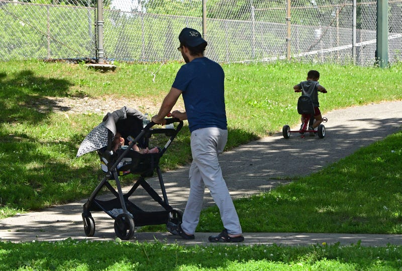 A man is seen pushing a baby carriage in New York