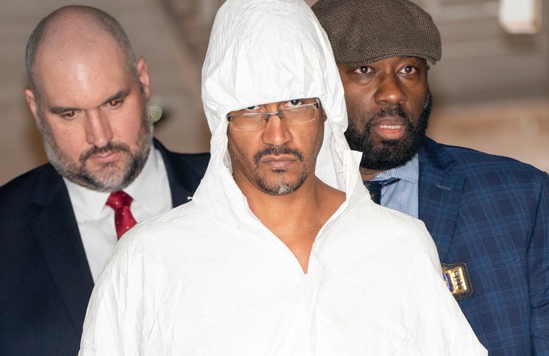 Sheldon Johnson Jr. is pictured in police custody leaving the NYPD 44th Precinct station house in the Bronx on Thursday, March 7, 2024