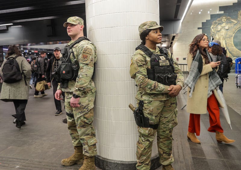 Security forces, including National Guard troops and police, take security measures at a subway station in New York, United States on March 7, 2024.