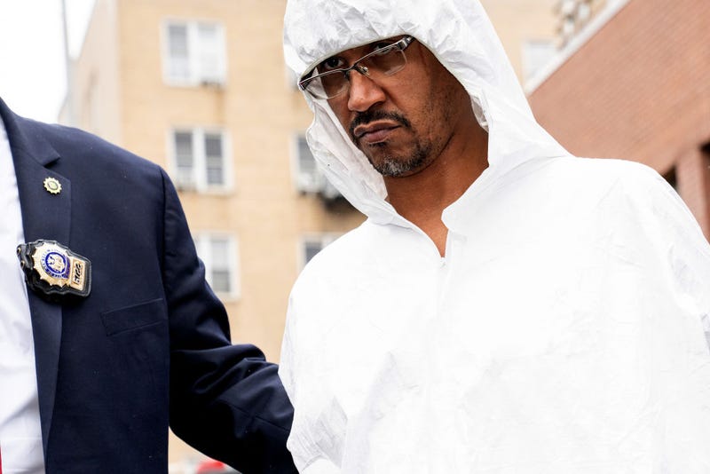 Sheldon Johnson Jr. is pictured in police custody leaving the NYPD 44th Precinct station house in the Bronx on March 7, 2024.