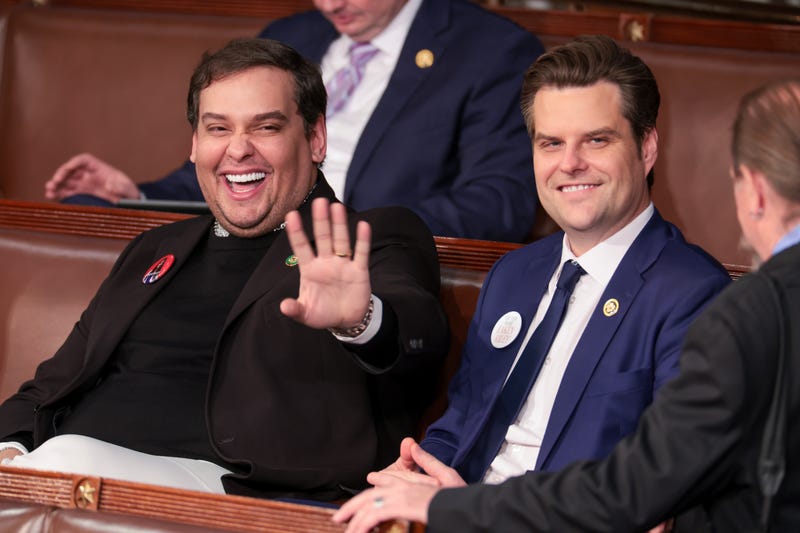 Former U.S. Rep. George Santos (R-NY) (L) sits with Rep. Matt Gaetz (R-FL) at U.S. President Joe Biden's State of the Union address during a joint meeting of Congress in the House chamber at the U.S. Capitol on March 7, 2024