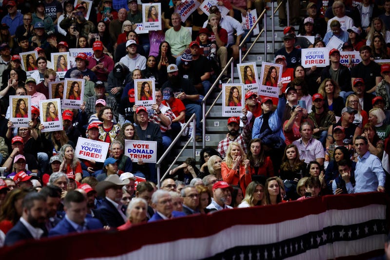 Supporters of Republican presidential candidate and former U.S. President Donald Trump hold up posters with the image of Laken Riley during at a campaign rally for Trump at the Forum River Center March 09, 2024 in Rome, Georgia. Laken Riley, 22, was a University of Georgia student who was murdered on February 22 and police have arrested an undocumented immigrant for the crime. Both Trump and President Joe Biden are holding campaign events on Saturday in Georgia, a critical battleground state, two days before the its primary elections. (Photo by Chip Somodevilla/Getty Images)